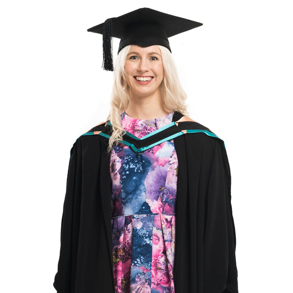 Woman wearing a UNE bachelor graduation gown, graduation hat and graduation hood
