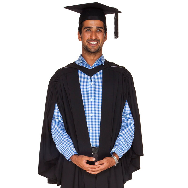 Man wearing a black Victoria Uni bachelor graduation gown, academic hood and graduation hat (mortarboard)