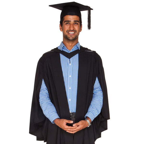 Man wearing Uni Vic bachelor graduation outfit with bachelor gown and graduation hat