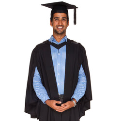 Man wearing a black bachelor gown and black felt graduation hat for a bachelor graduation at Griffith University 
