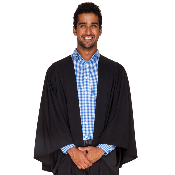 Man wearing a black bachelor graduation gown