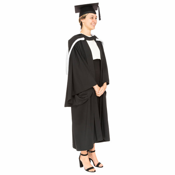 Woman wearing a USYD graduation outfit with gown, mortarboard and academic hood