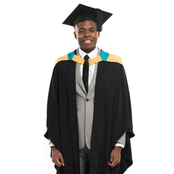 Man wearing a masters graduation gown and graduation hat from Macquarie University 