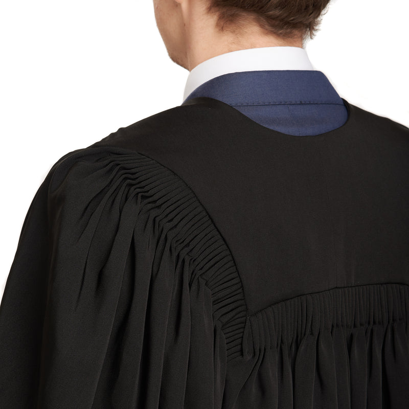 Detailed photo of a man wearing a University of Tasmania master's graduation gown