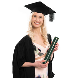 Woman wearing a masters graduation gown with a graduation hat