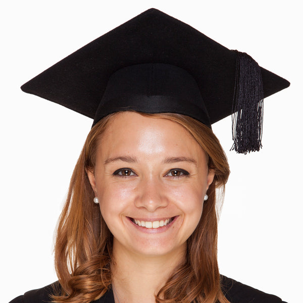 Student wearing a black felt graduation hat with black tassel