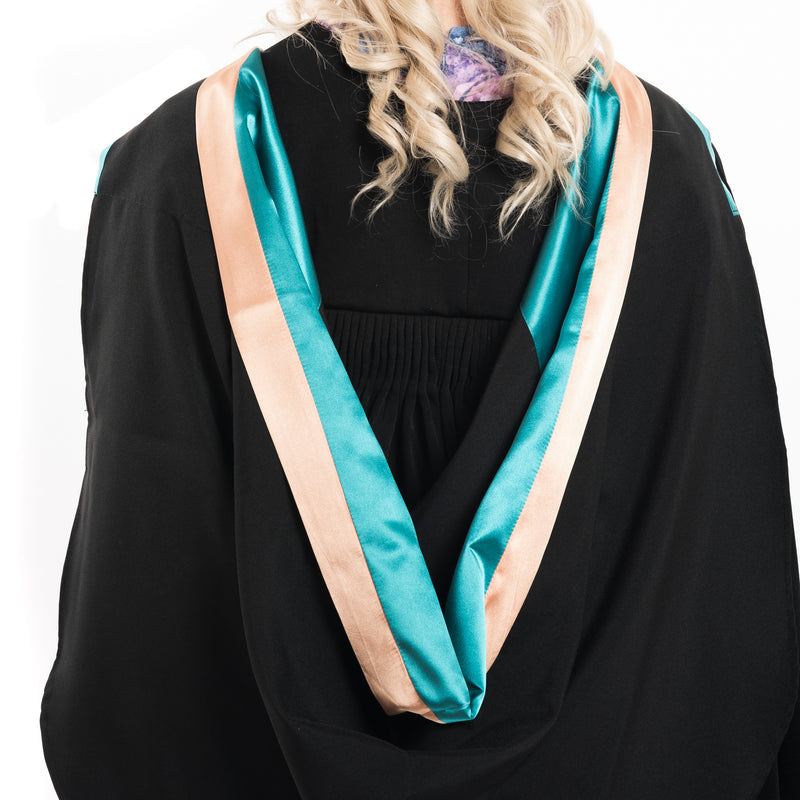 Photo of a woman from behind wearing a UNE master's graduation hood