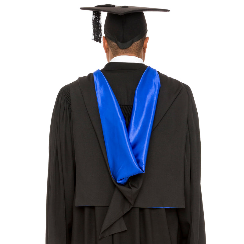 Man wearing a University of Queensland Master's graduation hood and graduation cap