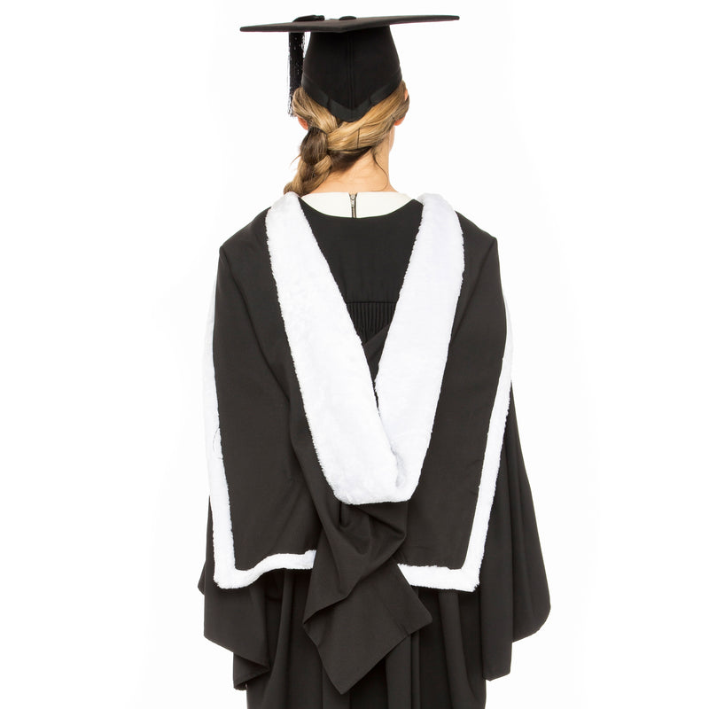 Woman wearing a USYD bachelor of Arts graduation hood with gown and graduation hat