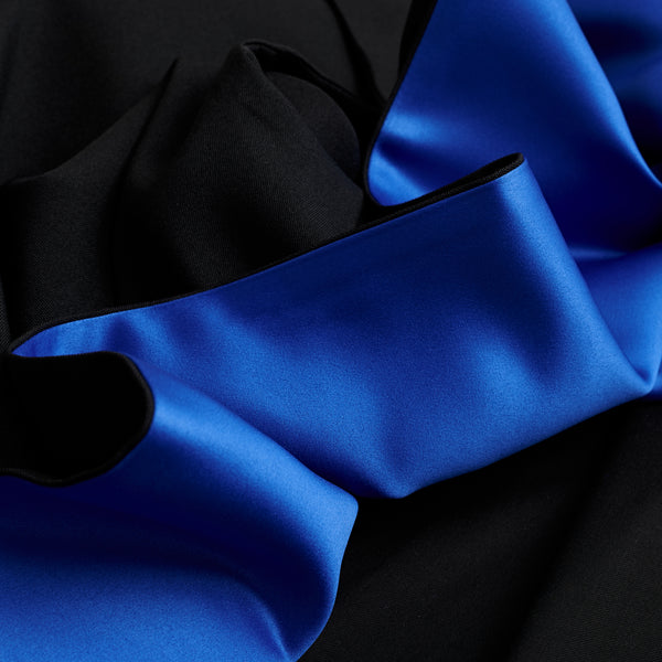 Close up photo of a UQ graduation hood, lined with blue satin